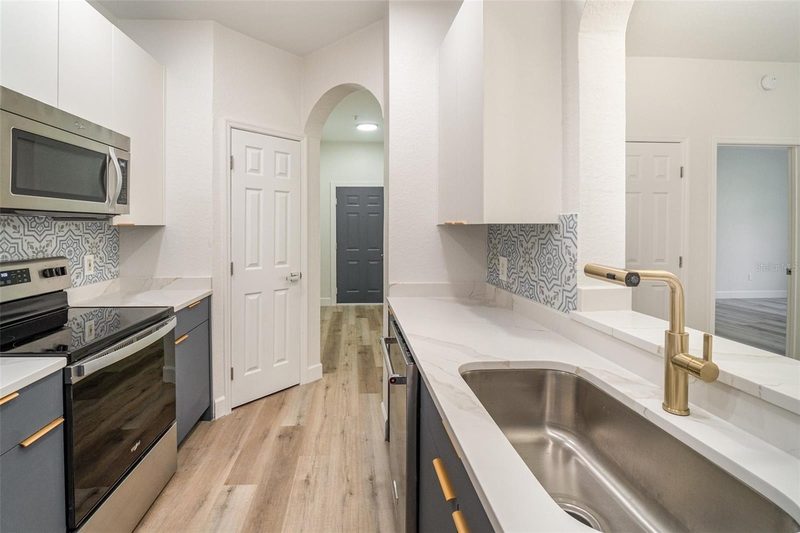 Modern kitchen with custom cabinetry and tile