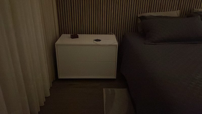 Contemporary bedroom with custom nightstand storage