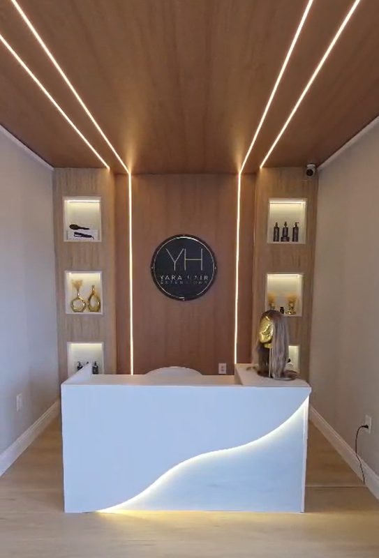 Modern reception area with illuminated display shelving