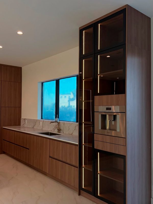 Contemporary kitchen with illuminated cabinetry