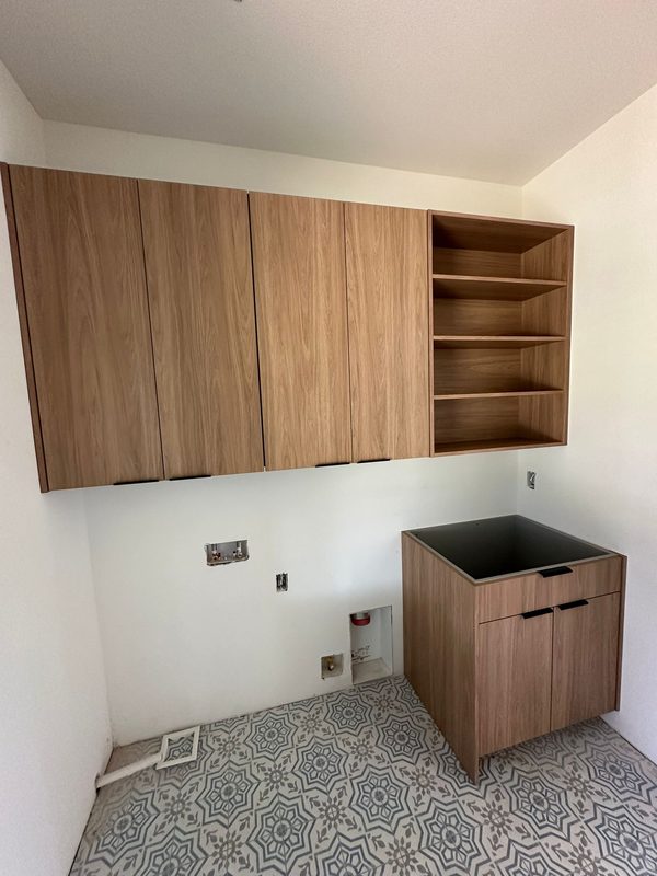 Custom Laundry Room with Walnut Cabinetry