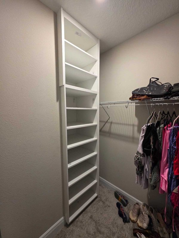 Upscale closet with floor-to-ceiling shelving