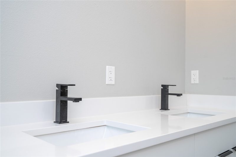 Elegant bathroom with custom vanity and fixtures