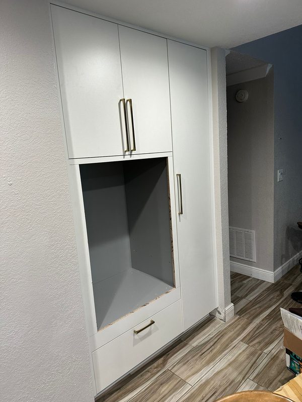 Modern closet with custom white cabinetry