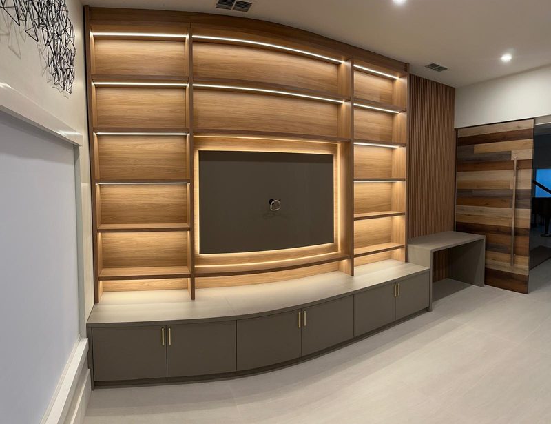 Contemporary media room with integrated cabinetry