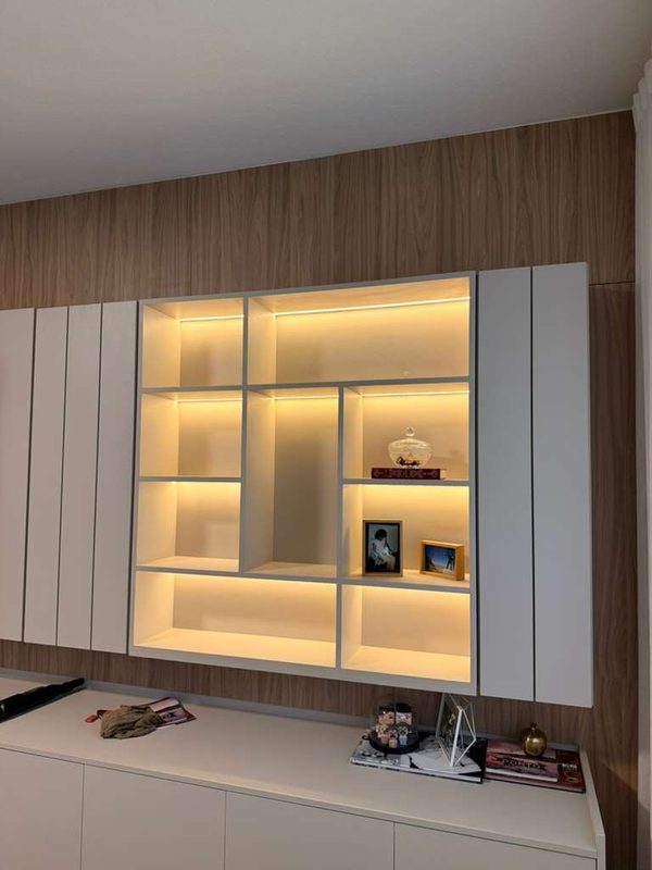 Elegant living room with illuminated display shelving
