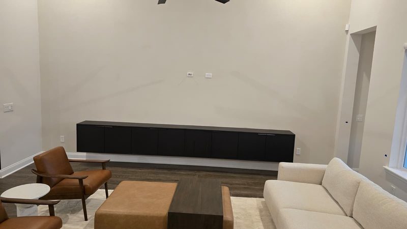 Modern media room with custom cabinetry